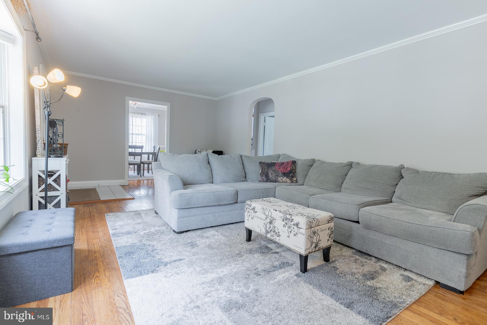 223 Sycamore Road Linthicum Heights, MD 21090 - Photo 8 of 32 a living room with furniture and a couch