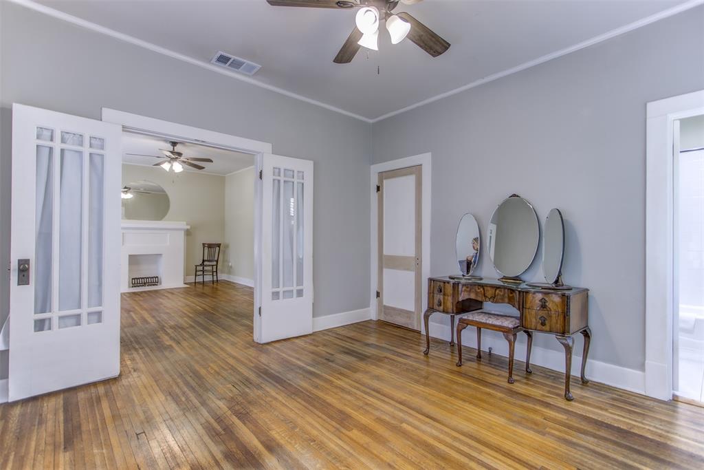 2220 West Rosedale Street South Fort Worth, TX 76110 - Photo 11 of 33 a view of a livingroom with furniture and wooden floor
