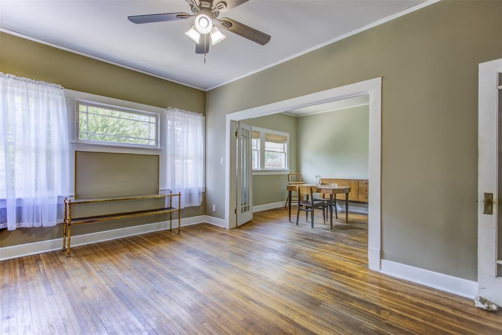 2220 West Rosedale Street South Fort Worth, TX 76110 - Photo 14 of 33 a view of a livingroom with furniture and a chandelier