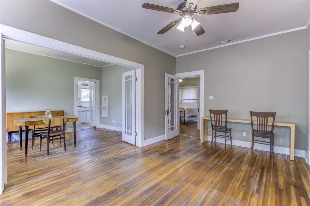 2220 West Rosedale Street South Fort Worth, TX 76110 - Photo 15 of 33 a view of a livingroom with furniture and chandelier fan