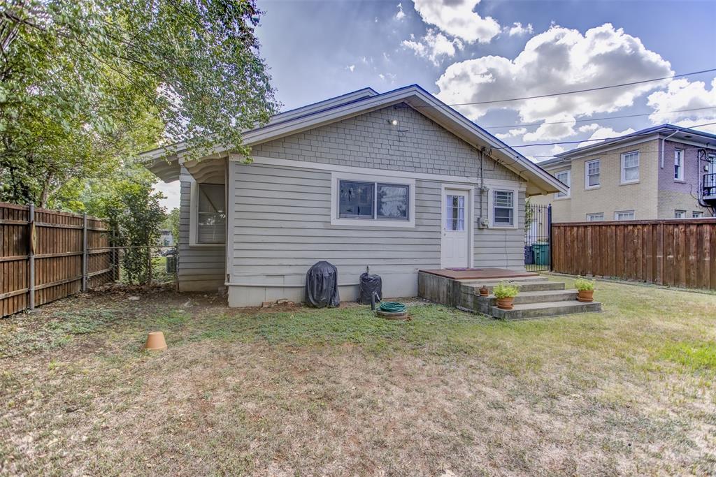 2220 West Rosedale Street South Fort Worth, TX 76110 - Photo 30 of 33 a view of a house with a yard and a large tree