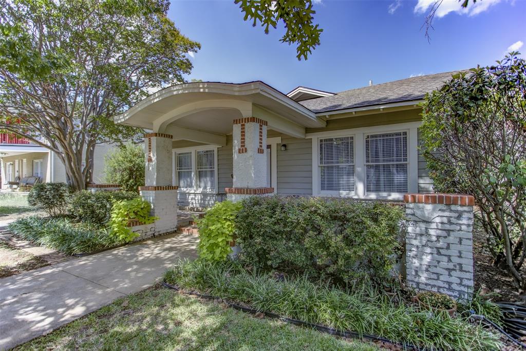 2220 West Rosedale Street South Fort Worth, TX 76110 - Photo 3 of 33 a front view of a house with garden