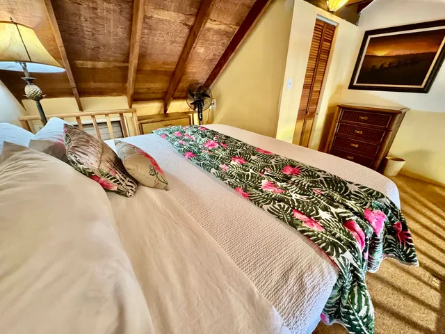 a view of a porch with wooden floor and furniture