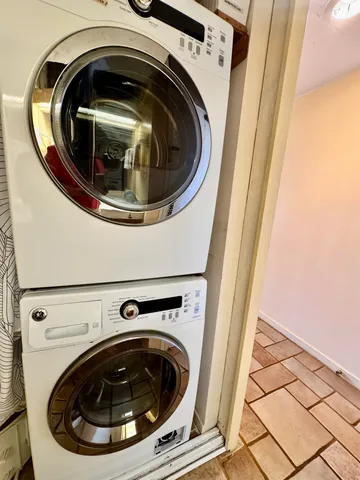 a bathroom with a sink a toilet a mirror and shower