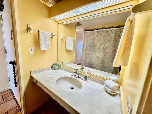 a bathroom with a shower and a bathtub