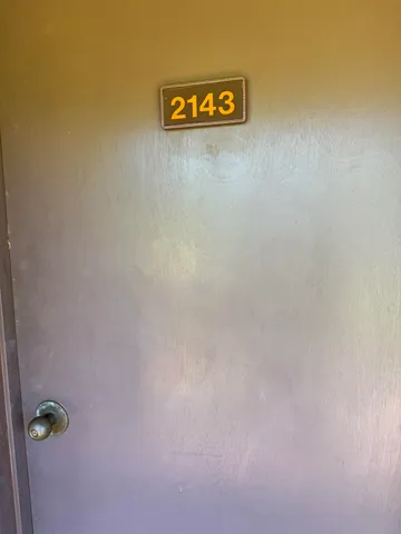 a view of a swimming pool with an outdoor space and seating area