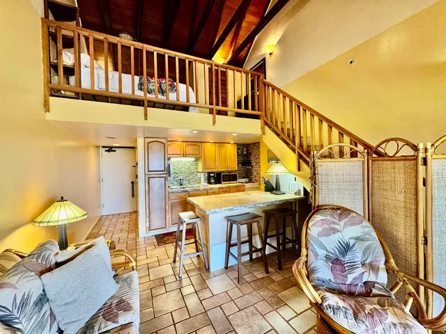 a balcony with table and chairs