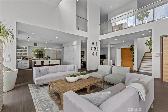 a living room with furniture and a large mirror