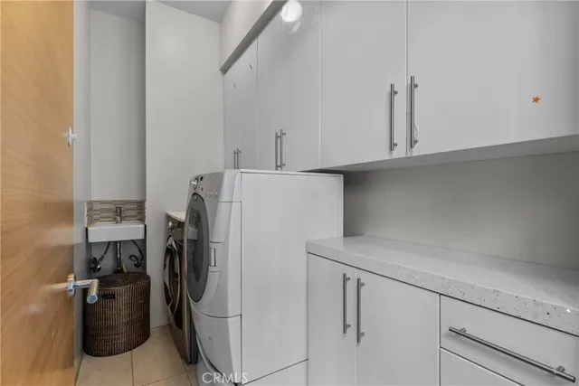 a view of a roof deck with couches and wooden floor