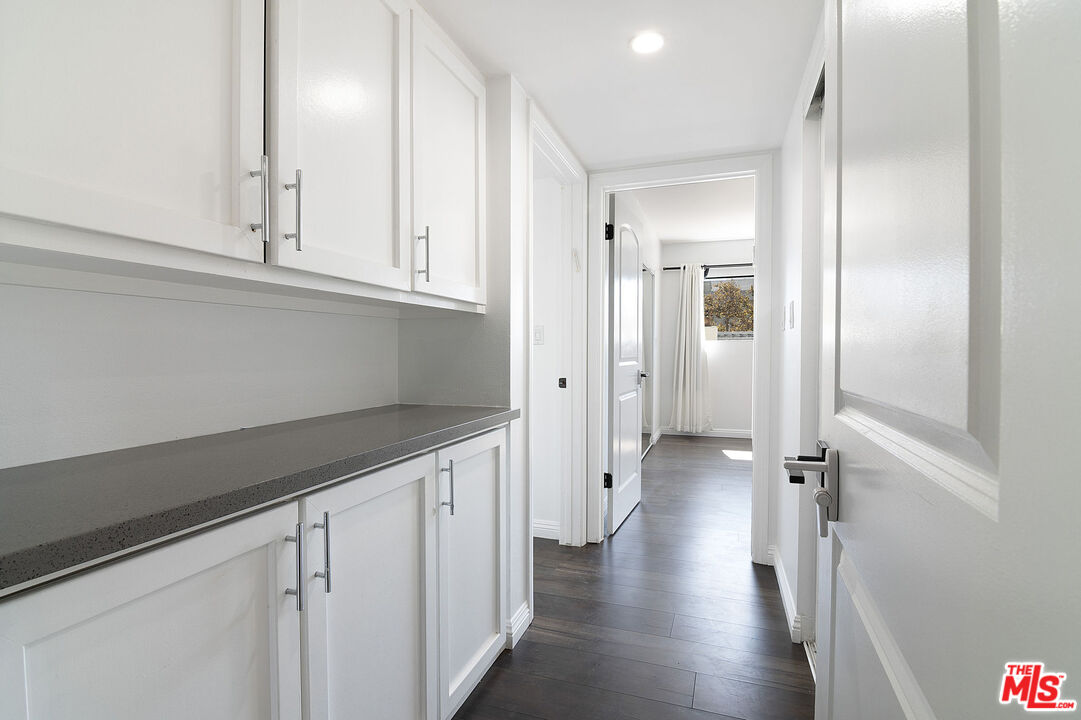 853 Le Doux Road, Unit 201 Los Angeles, CA 90035 - Photo 21 of 36 a view of a hallway with wooden floor