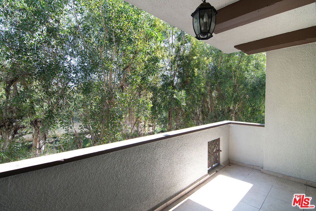 853 Le Doux Road, Unit 201 Los Angeles, CA 90035 - Photo 34 of 36 a view of a balcony with an outdoor space