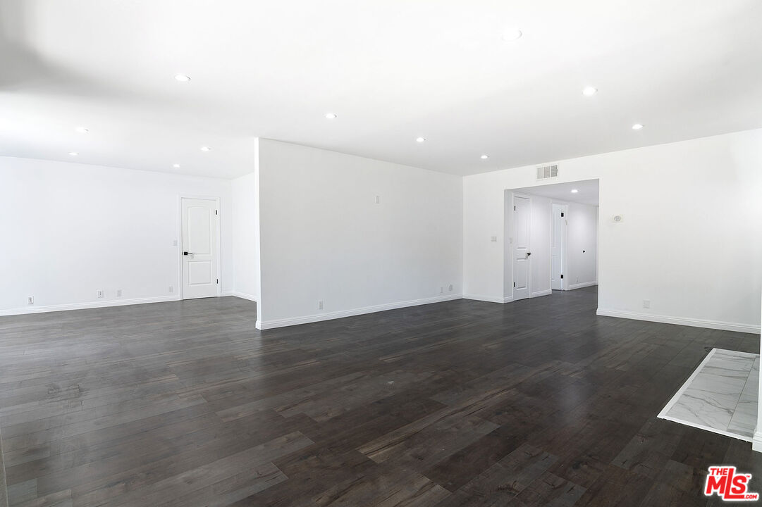 853 Le Doux Road, Unit 201 Los Angeles, CA 90035 - Photo 5 of 36 an empty room with wooden floor