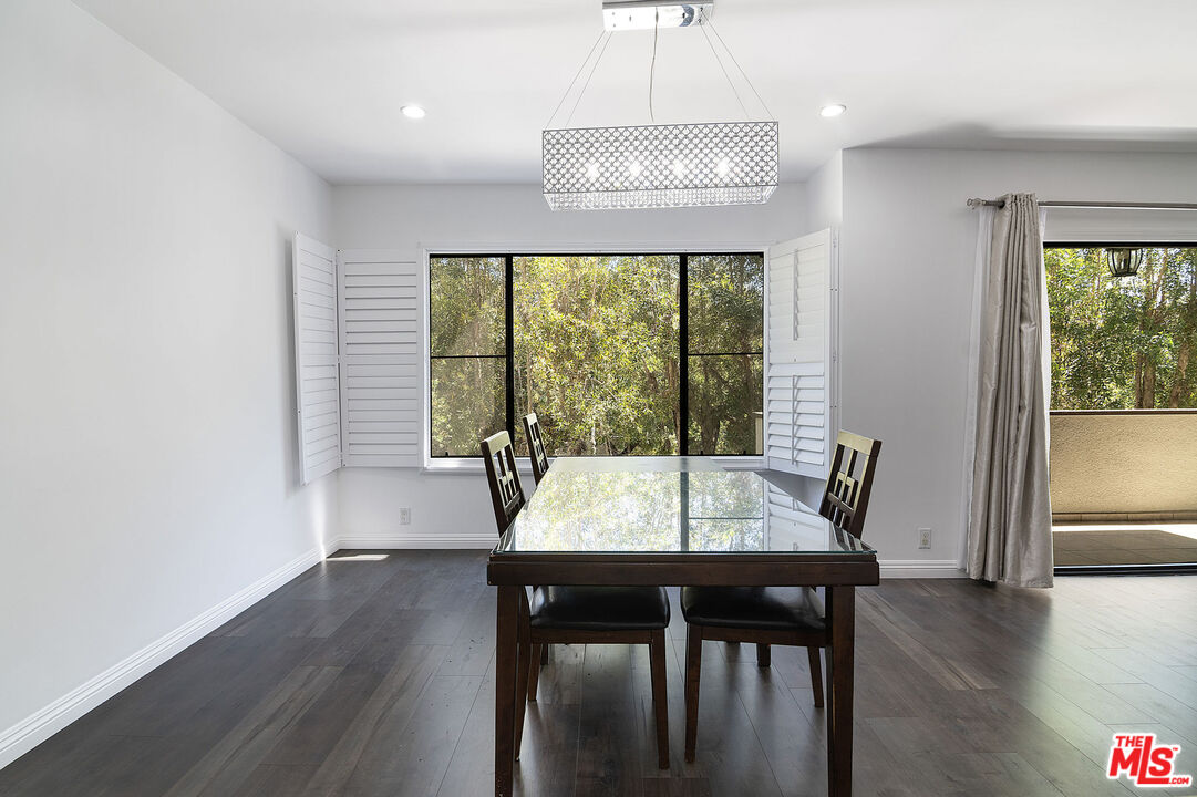 853 Le Doux Road, Unit 201 Los Angeles, CA 90035 - Photo 10 of 36 a view of a dining room with furniture window and wooden floor
