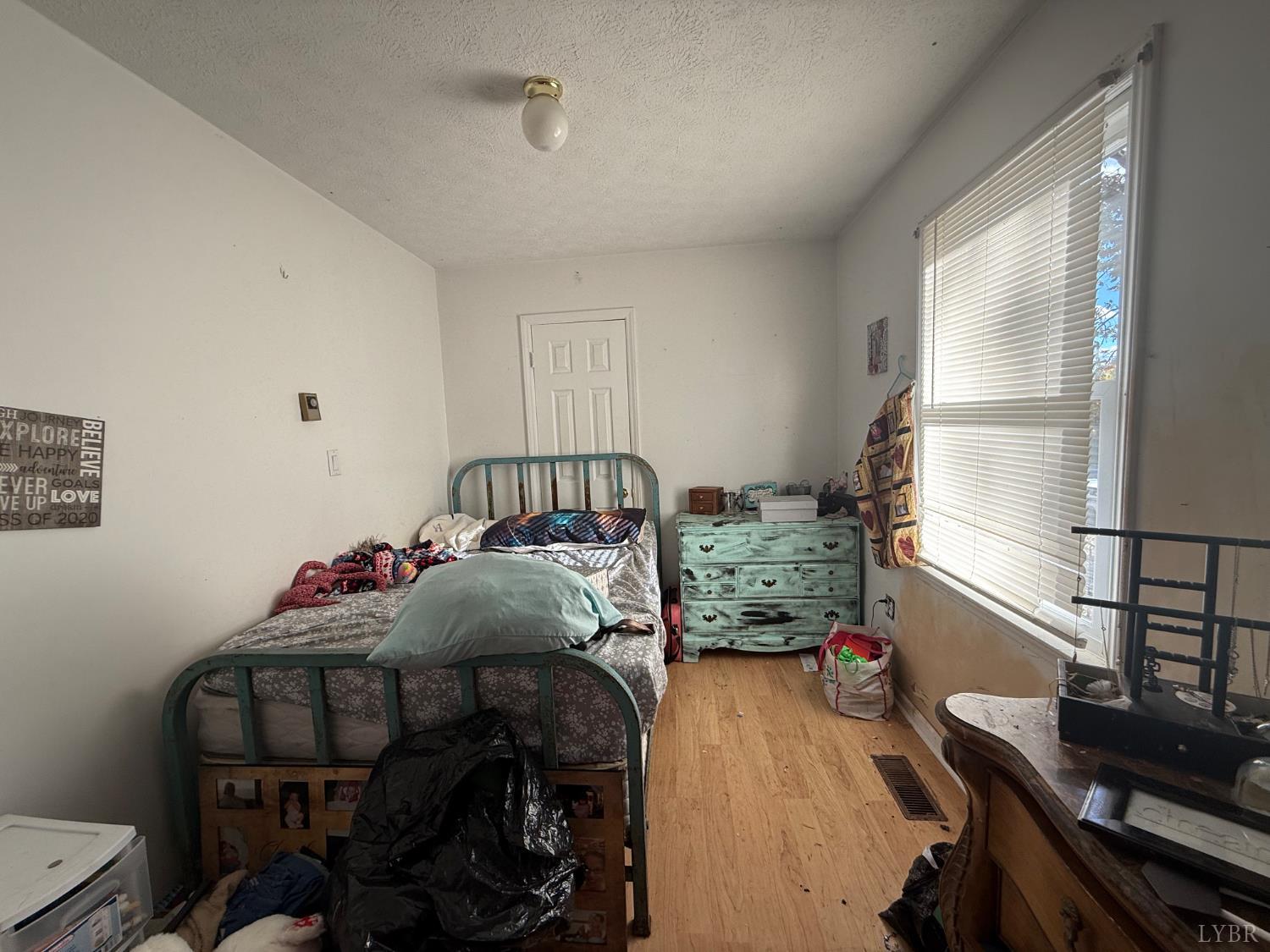 2600 Bethany Road Rustburg, VA 24588 - Photo 11 of 16 a bedroom with furniture and a window