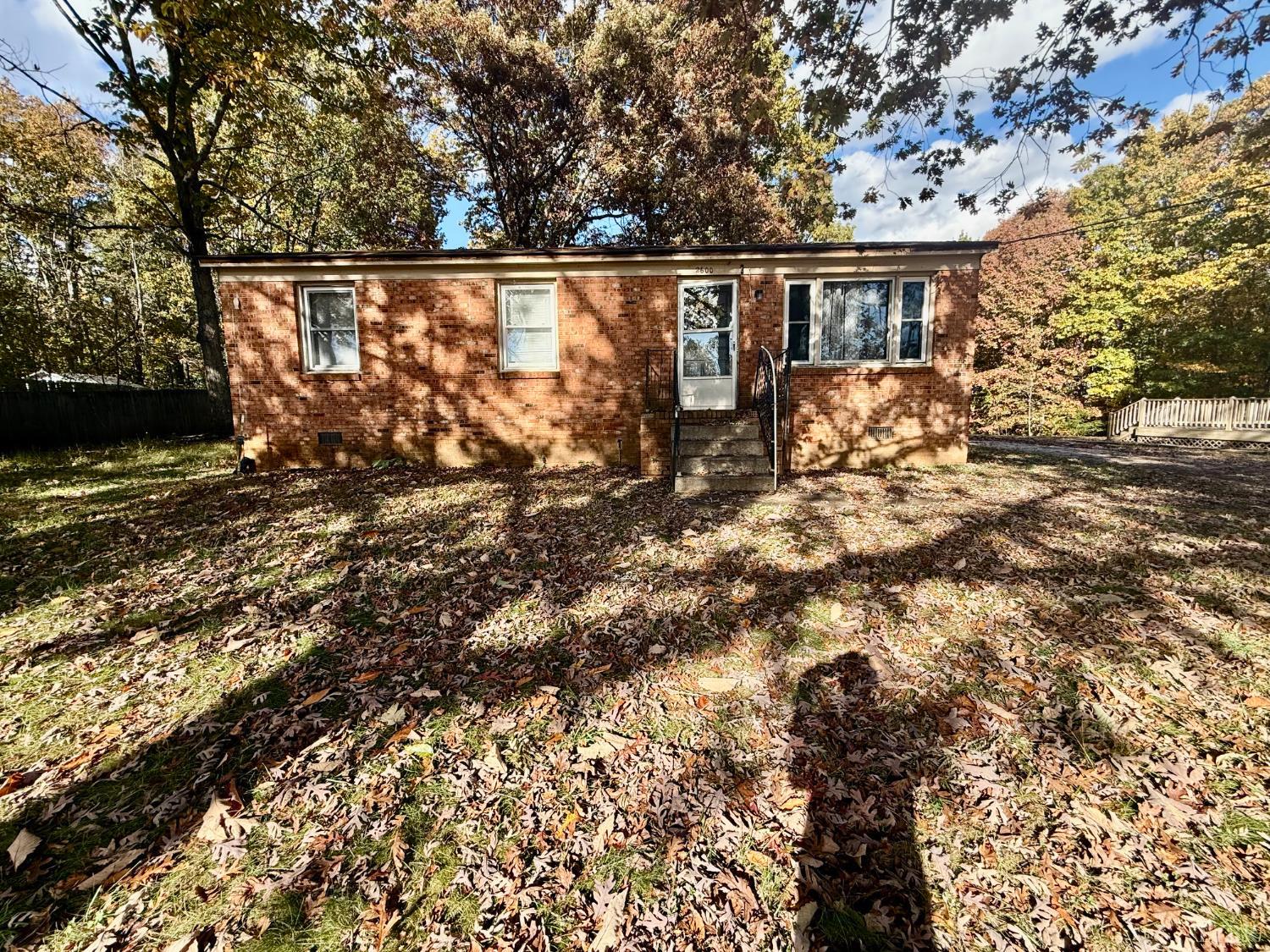 2600 Bethany Road Rustburg, VA 24588 - Photo 2 of 16 a view of roof deck with wooden fence and trees