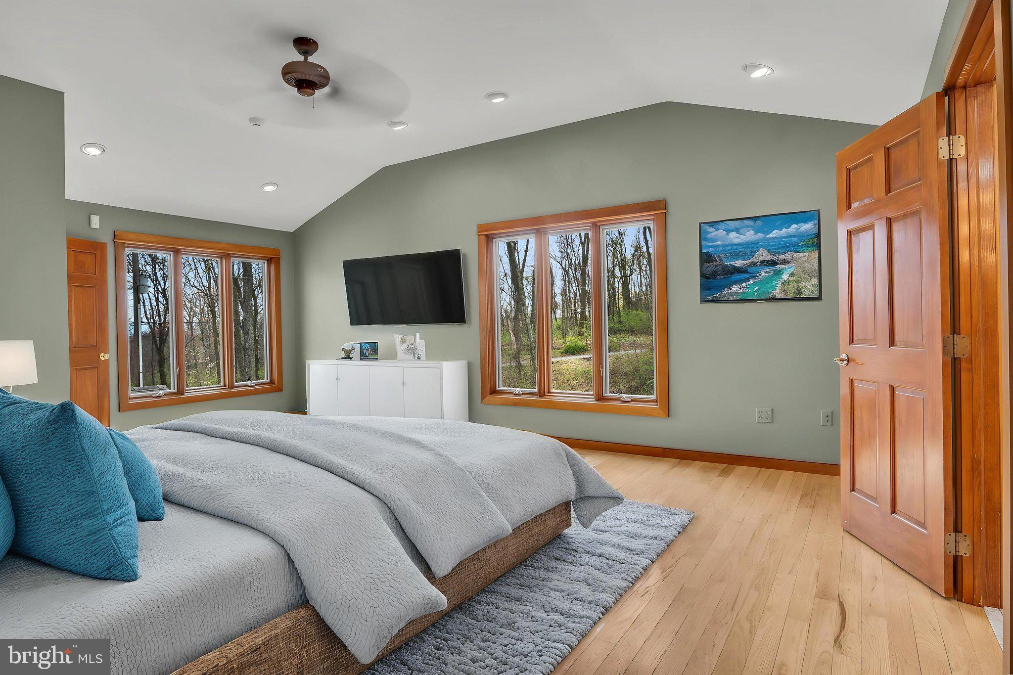 125 Bobcat Road Carlisle, PA 17015 - Photo 27 of 83 a bedroom with a large bed and a flat tv screen on dresser