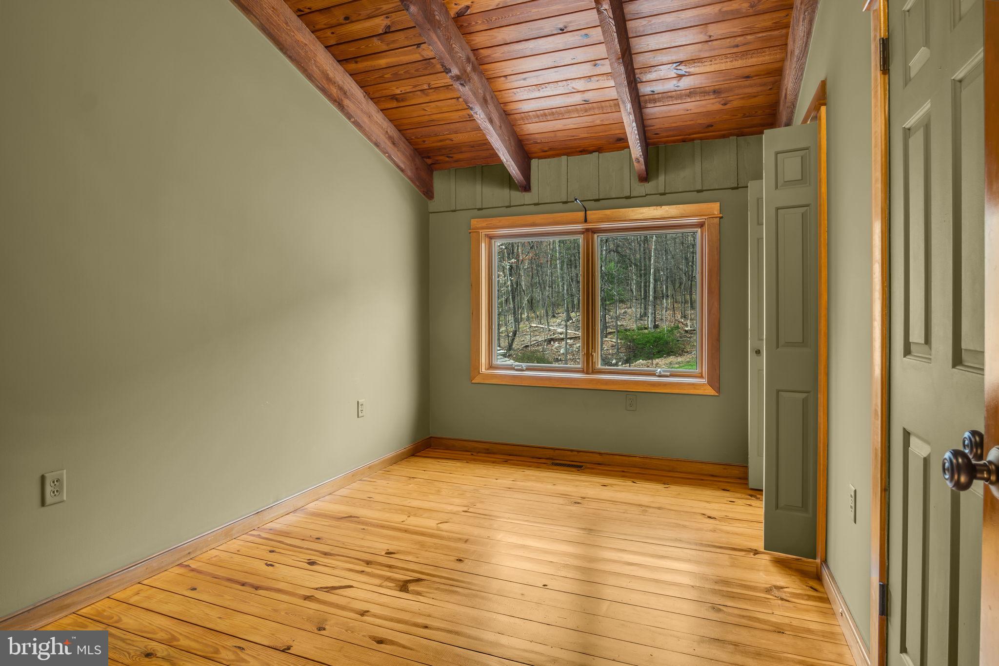 125 Bobcat Road Carlisle, PA 17015 - Photo 38 of 83 a view of empty room with wooden floor and fan