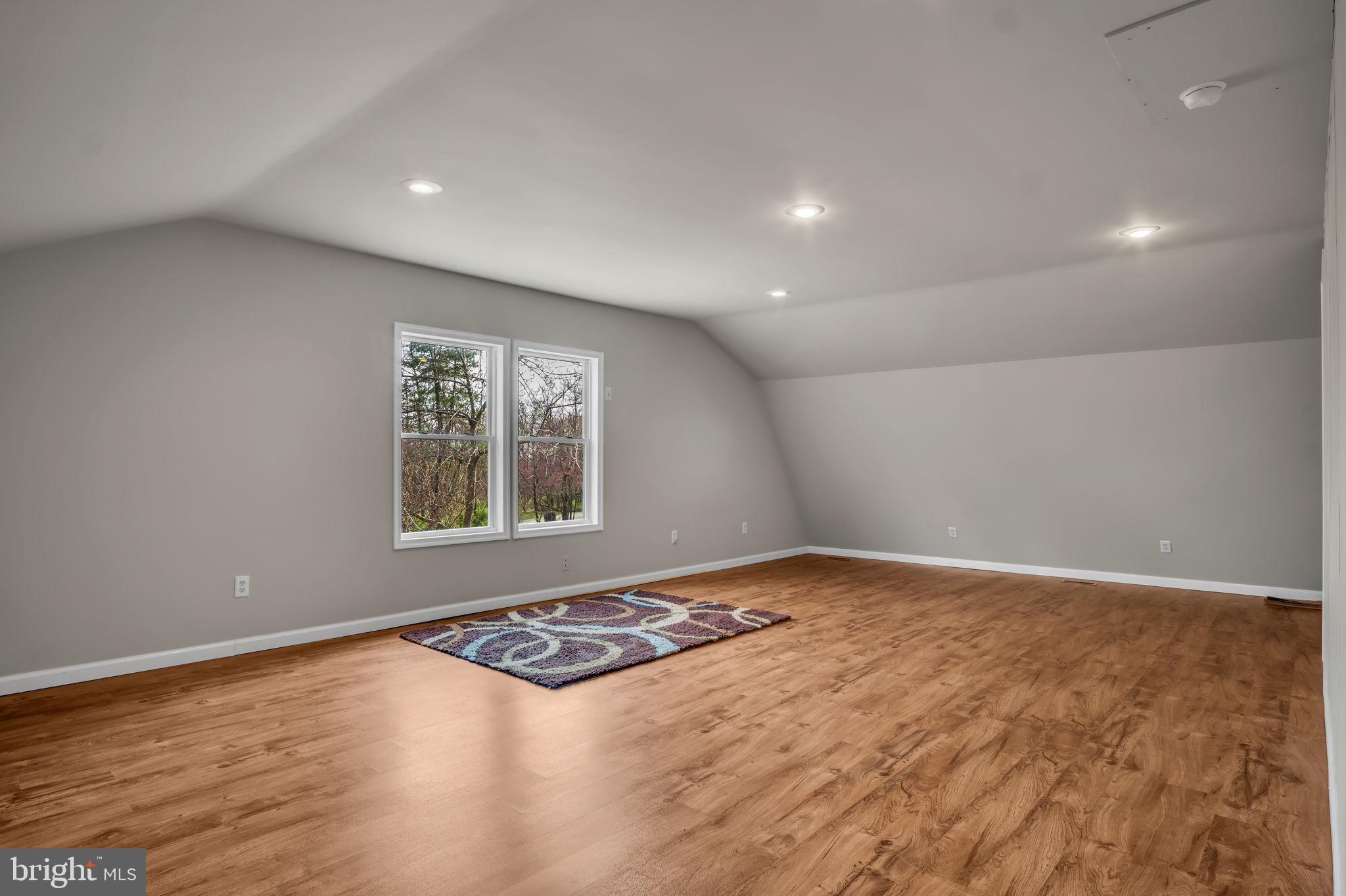 125 Bobcat Road Carlisle, PA 17015 - Photo 68 of 83 a view of an empty room with window and wooden floor
