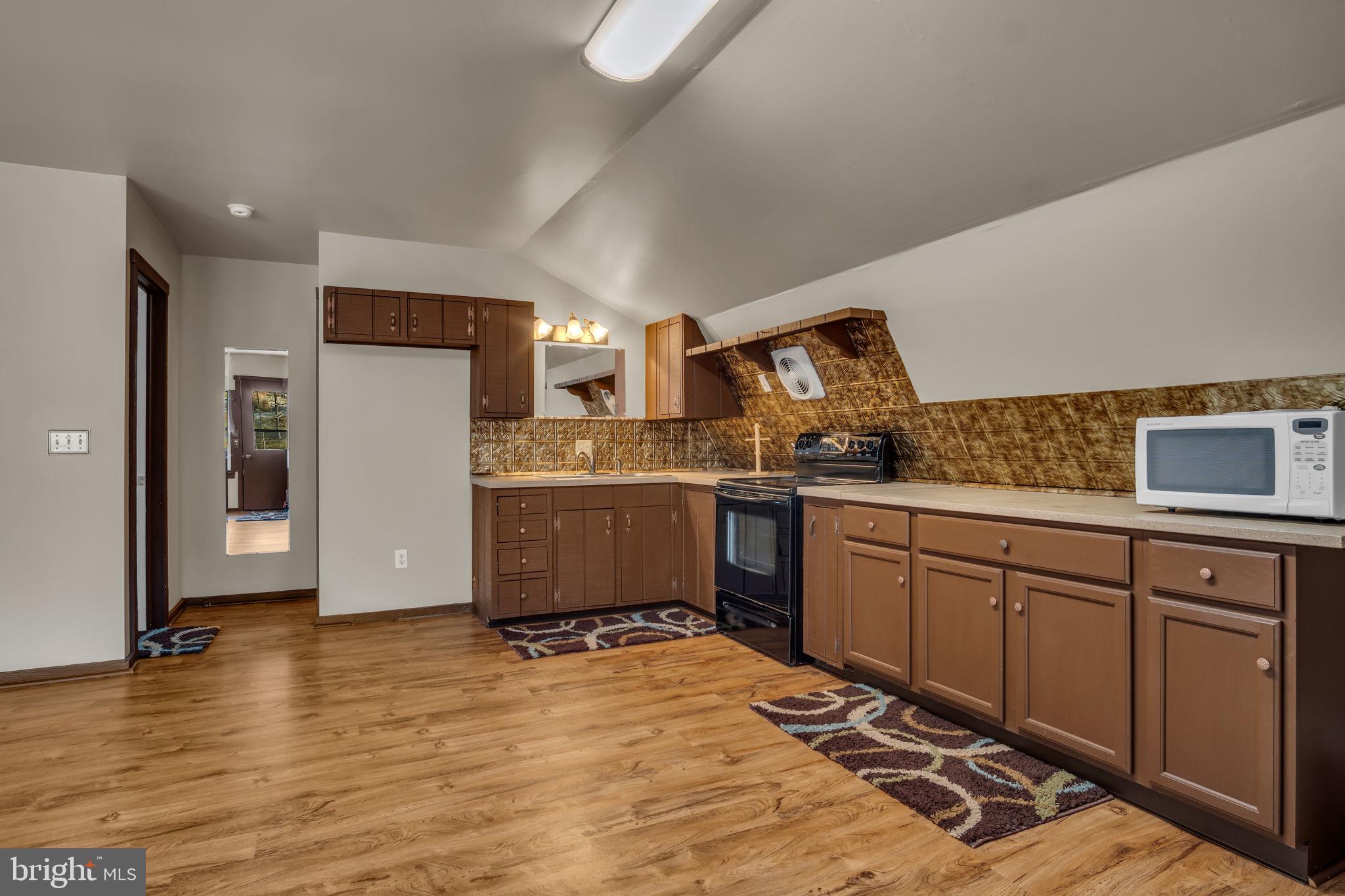 125 Bobcat Road Carlisle, PA 17015 - Photo 72 of 83 a kitchen with granite countertop a sink cabinets and stainless steel appliances