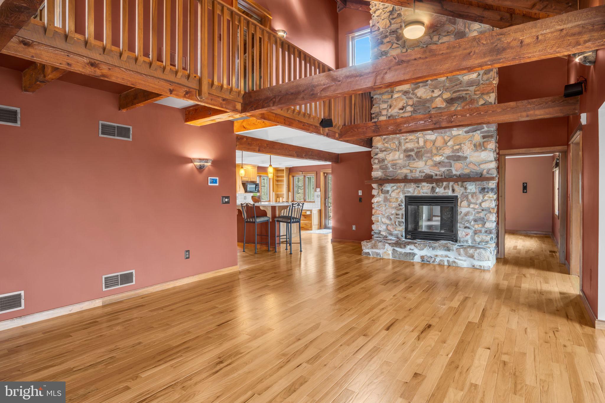 125 Bobcat Road Carlisle, PA 17015 - Photo 8 of 83 a view of a livingroom with wooden floor and a fireplace