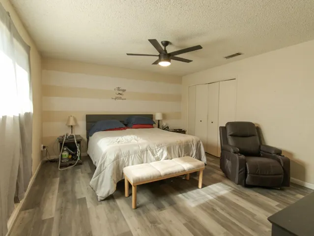 a kitchen with a table chairs stove and cabinets