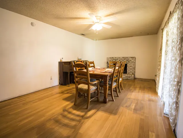 a bedroom with a bed and a night stand