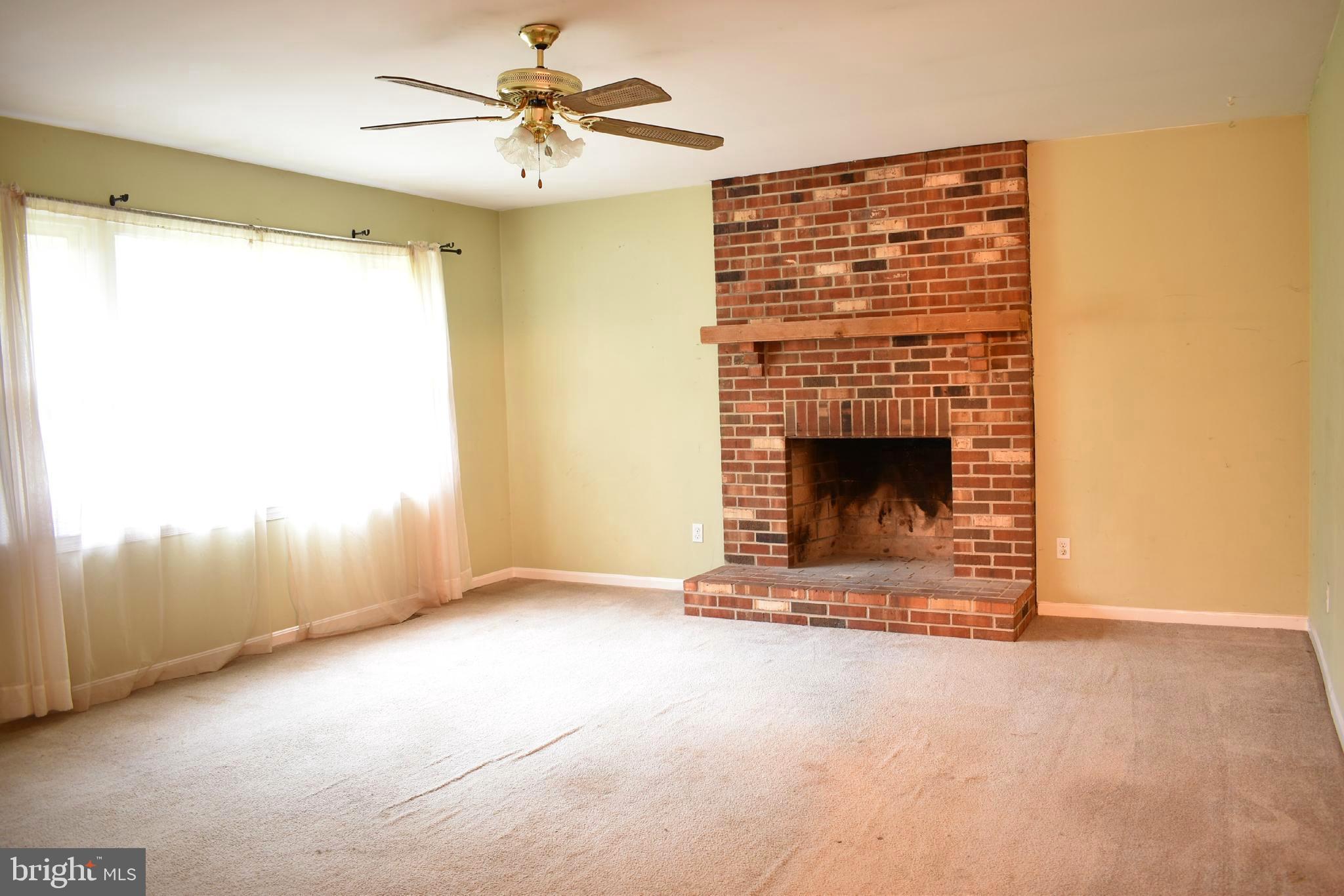 11510 Alum Springs Road Rixeyville, VA 22737 - Photo 14 of 41 Living Room with Wood Fireplace