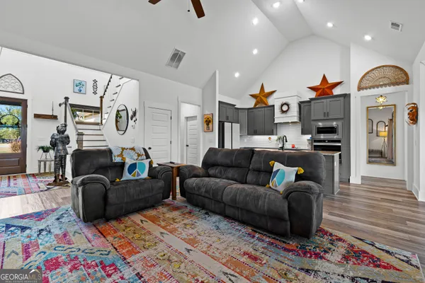 a living room with furniture and a window