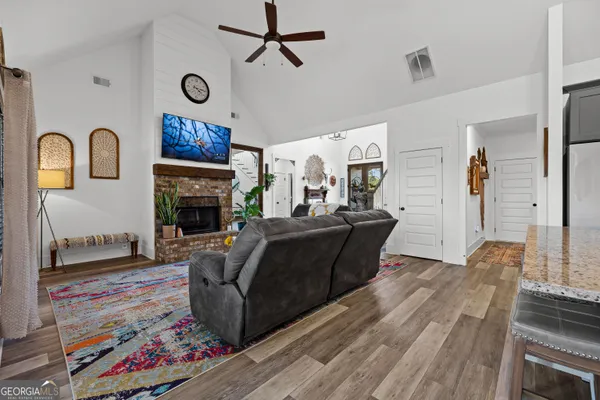 a view of a dining room with furniture window and wooden floor