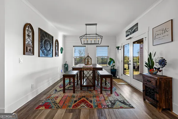 a living room with granite countertop furniture and wooden floor