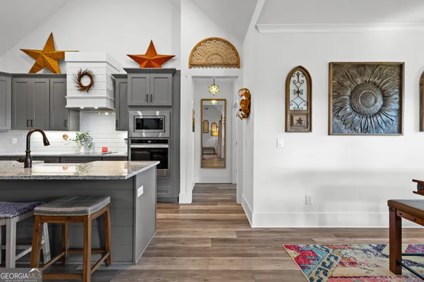 a bedroom with bed and flat tv screen
