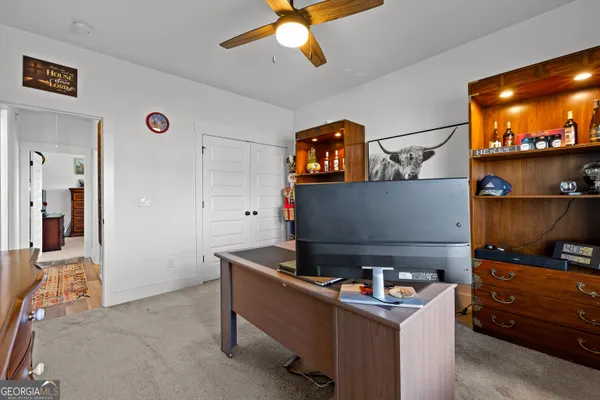 a bedroom with furniture and a window