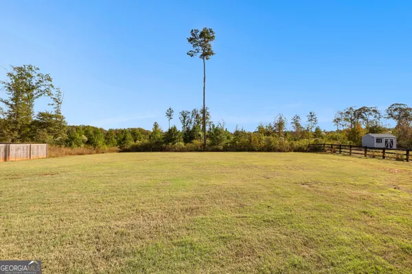 a bathroom with a granite countertop sink mirror and double