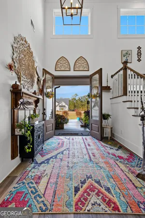 a living room with furniture and a rug