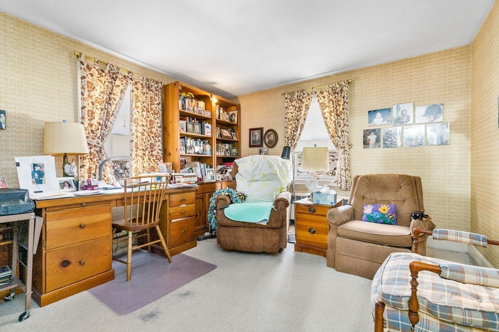 177 Varick Road Newton, MA 02468 - Photo 13 of 29 a living room with furniture and a large window