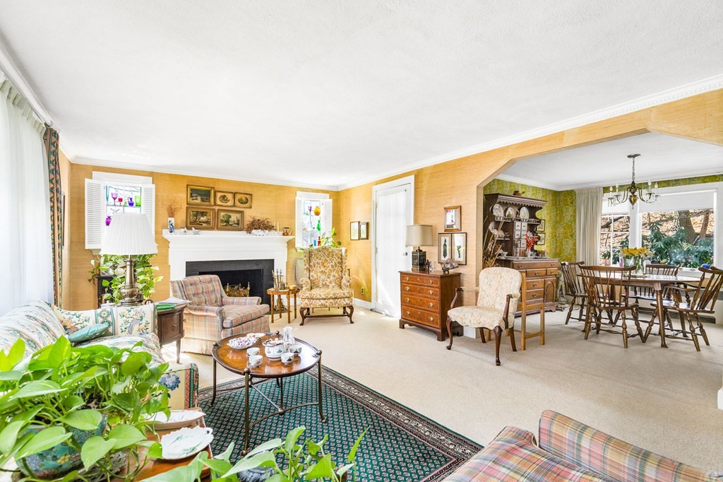177 Varick Road Newton, MA 02468 - Photo 16 of 29 a living room with fireplace furniture and a large window