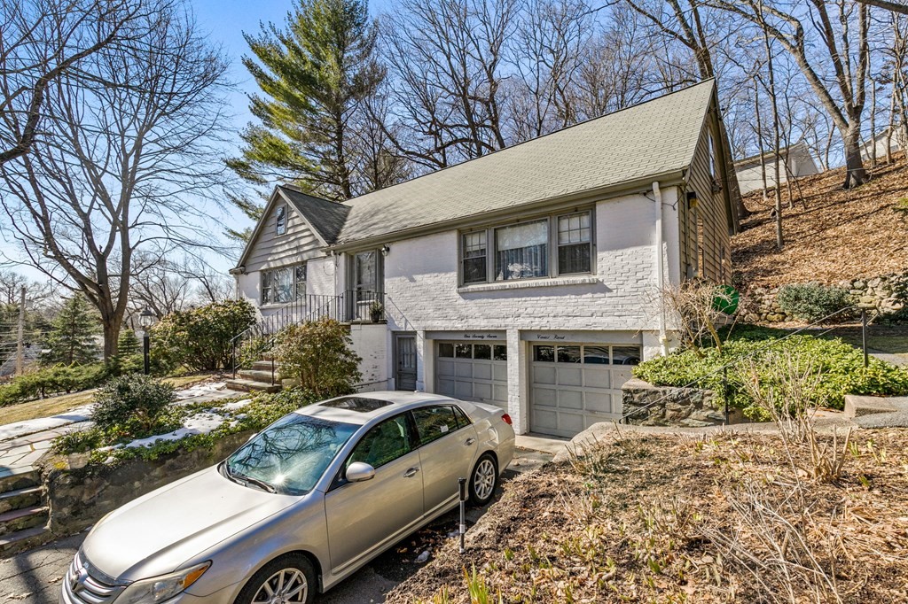 177 Varick Road Newton, MA 02468 - Photo 26 of 29 a view of a car parked in front of a house