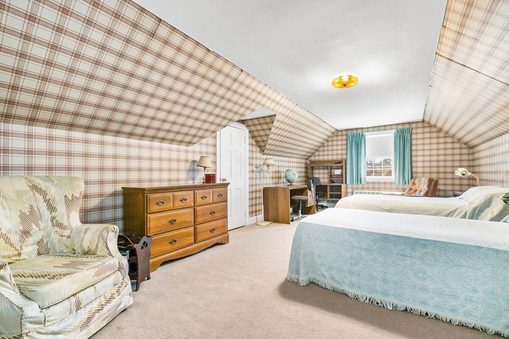 177 Varick Road Newton, MA 02468 - Photo 8 of 29 a bedroom with a bed and a dresser