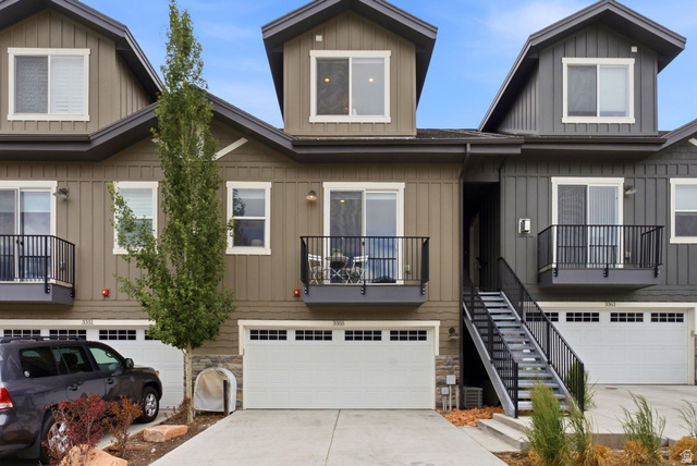 3355 Santa Fe Road Park City, UT 84098 - Photo 29 of 45 Contemporary townhome exterior featuring vertical siding, dormer windows, and a private balcony with black railings