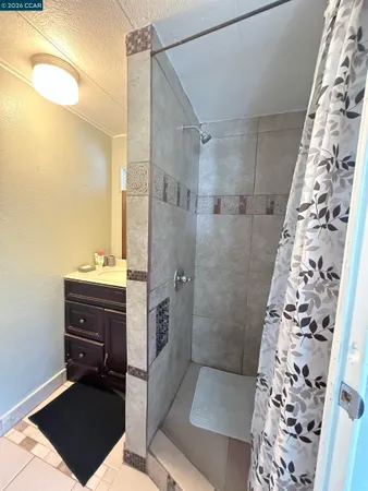 a bathroom with a bathtub and shower