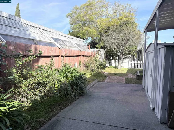 a view of a back yard of the house