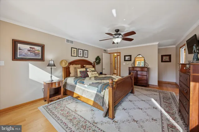 a living room with furniture a flat screen tv and a table
