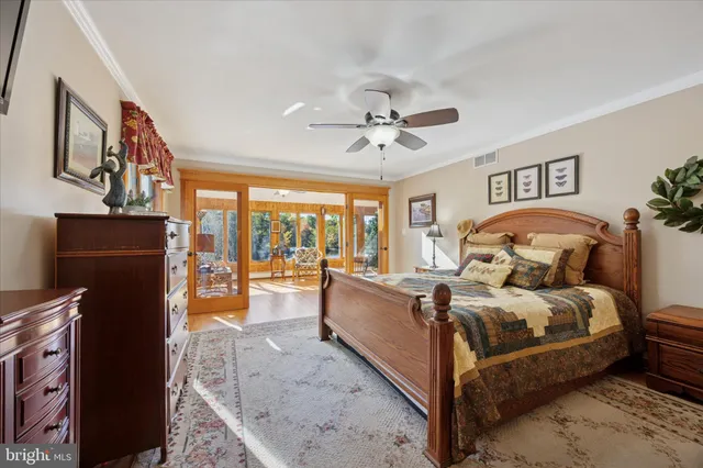 a bed room with a bed and a chandelier