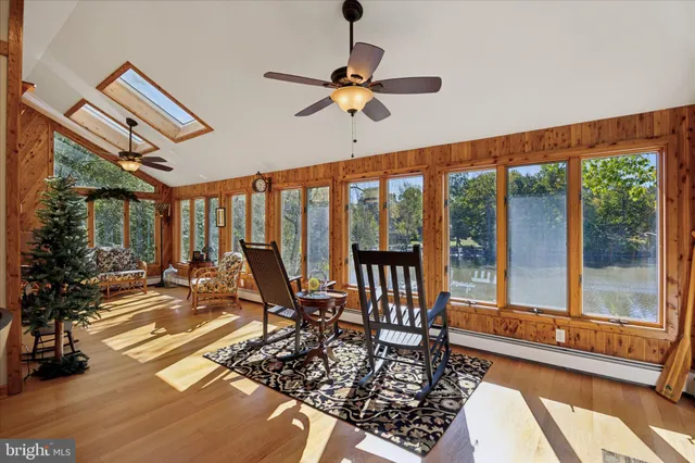 a view of an entryway with wooden floor