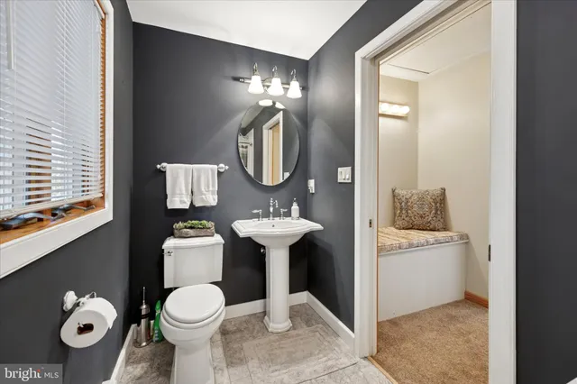 a dining room with wooden floor and furniture