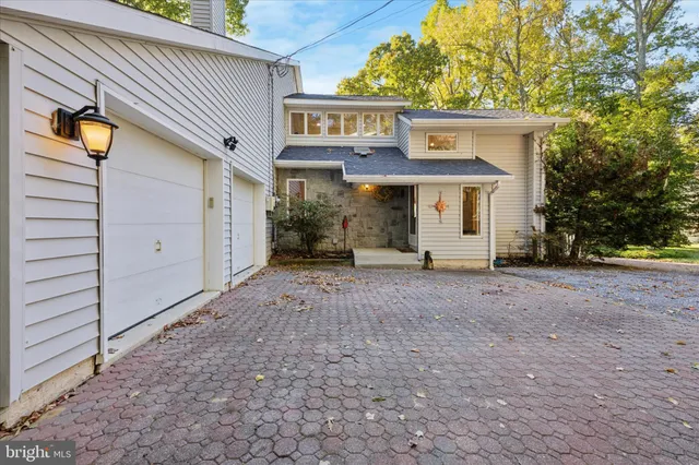 a view of a house with a yard and garage