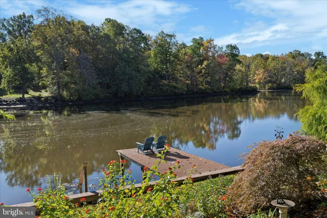 an aerial view of a house with a lake view