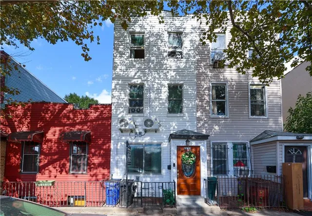 a front view of a building with retail shops