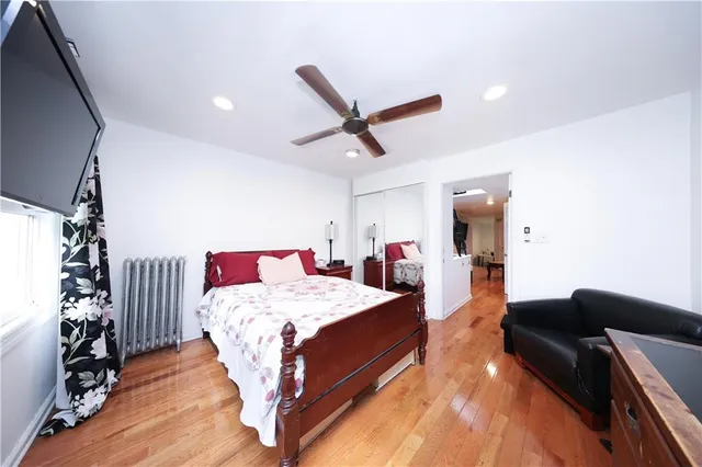 a bed room with a bed and a chandelier