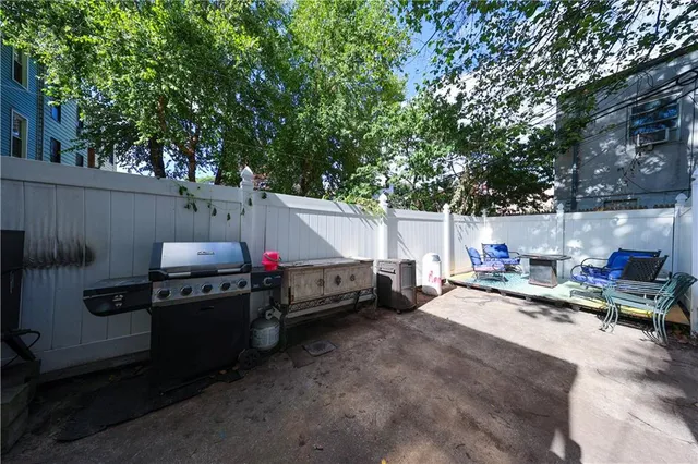 a view of a patio in the backyard